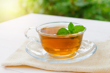 A Cup of tea on a wooden table.