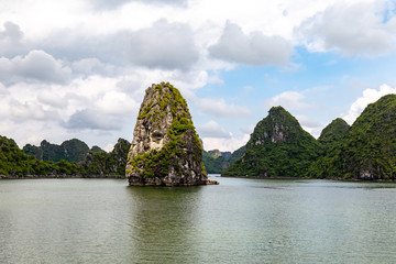 Fototapeta na wymiar Karst formations in Halong Bay, Vietnam, in the gulf of Tonkin. Halong Bay is a UNESCO World Heritage Site and the most popular tourist spot in Vietnam