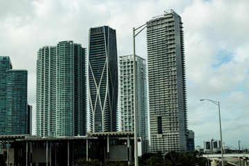 Fototapeta na wymiar Scenic view Downtown Miami's skyscrapers from the road; droad tour in Florida.