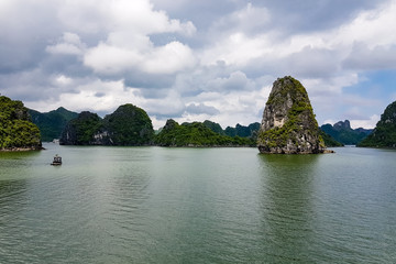 Fototapeta na wymiar Karst formations in Halong Bay, Vietnam, in the gulf of Tonkin. Halong Bay is a UNESCO World Heritage Site and the most popular tourist spot in Vietnam