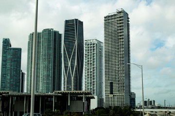 Fototapeta na wymiar Scenic view Downtown Miami's skyscrapers from the road; droad tour in Florida.