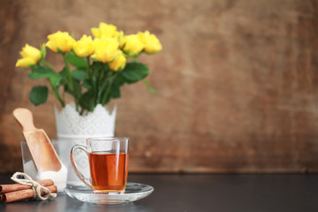 A cup with tea on the table