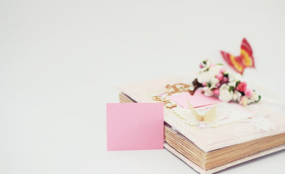 A diary for entries on a white table - Powered by Adobe