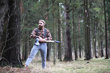 A bearded lumberjack with a large ax