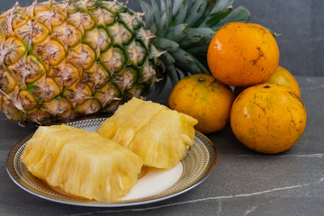Fototapeta na wymiar Fresh fruit, Pineapple and oranges.
