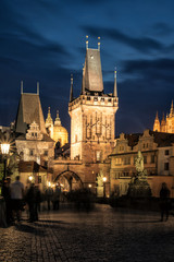 Night view on gothic tower on Charles Bridge in Prague, Czech Republic