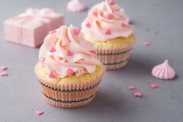 Vanilla cupcakes with pink raspberry frosting for Valentine's Day
