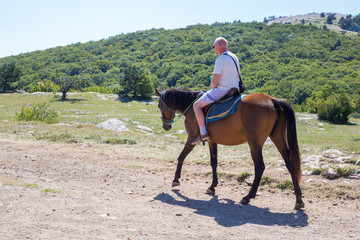 man riding a horse