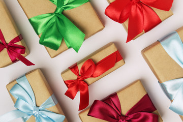 Gifts packed with craft paper and colorful satin ribbons