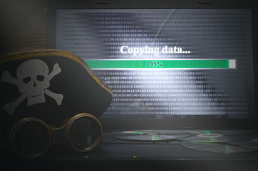 Illegal data copying concept. Cybercrime. Computer piracy background. Pirate hat, binoculars,...