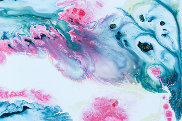 Abstract colorful background. Drawing with acrylic paints on water. Texture play of paint