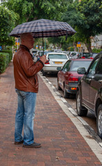 the man with the umbrella on the street
