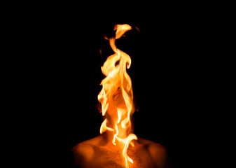 man's head burns on a black background