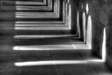 Light and shadow in the cloister in the Kaiserdom of Königslutter am Elm in bright sunshine