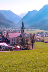 Village of Gosau with its wooden houses in the Alps of Austria on a sunny day.