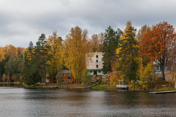 Fototapeta na wymiar Houses on the shore of the lake ar fall season. Nelijarve, Estonia.