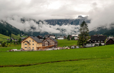 Village of Gosau with its wooden houses in the Alps of Austria on a sunny day.