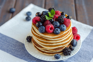Pancakes with raspberries in the pan.
