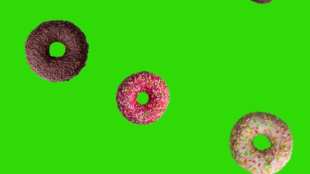 Animation of falling tasty donuts on green screen. Animation of seamless loop, 4K