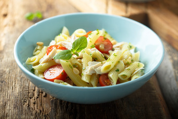 Pasta salad with tomato and chicken