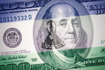 Obraz na płótnie Canvas flag of lesotho on a american dollar money background
