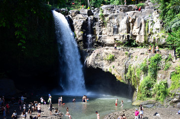 Bali / Indonesia - May 19 / 2017 : Tourists having fun at Blangsinga waterfall