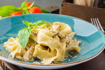 Homemade pasta pappardelle with mushrooms, and creamy sauce.