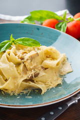 Italian pasta pappardelle with wild mushrooms and creamy sauce.