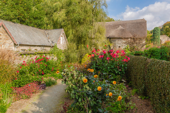 Pathway leading to the walled garden and old vicarage at the garden house devon uk