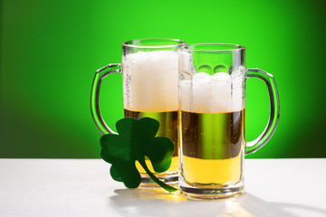 Two mugs of beer. Concept for St. Patrick's day.