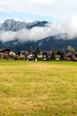 Fototapeta na wymiar Rural village in the Austrian Alps on a cloudy day