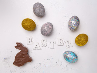 Lettering for Easter with eggs and chocolate bunny