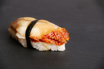 sushi with eel on slate background japanese food