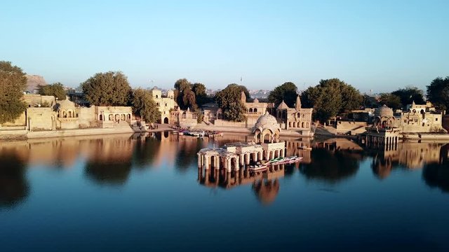 Aerial view 4k video by drone of Shrines And Temples At Gad sisar Lake, Jaisalmer, India - Rajasthan.