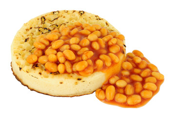 Baked beans on a large English crumpet isolated on a white background