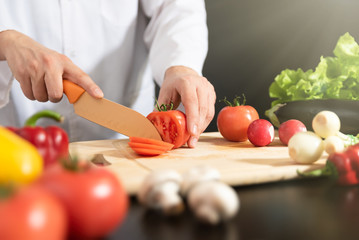 Chef prepares fresh vegetables. Healthy nutrition