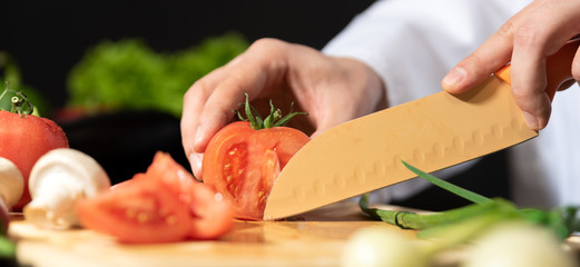 Chef prepares fresh vegetables. Healthy nutrition