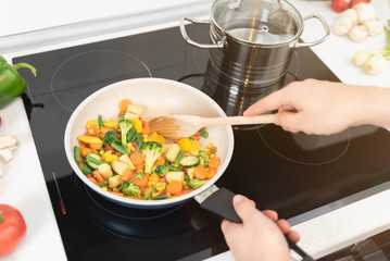 Fresh vegetables fried in a pan. Healthy nutrition concept
