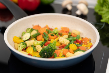 Fresh vegetables fried in a pan. Healthy nutrition concept