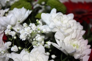 A flower bouquet with a lot of different flowers