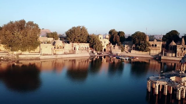 Aerial view 4k video by drone of Shrines And Temples At Gad sisar Lake, Jaisalmer, India - Rajasthan.