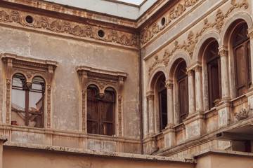 Fototapeta na wymiar beautiful old house windows with arch 