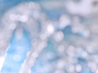 Blue background. Blue bokeh texture. Defocused abstract blue background.