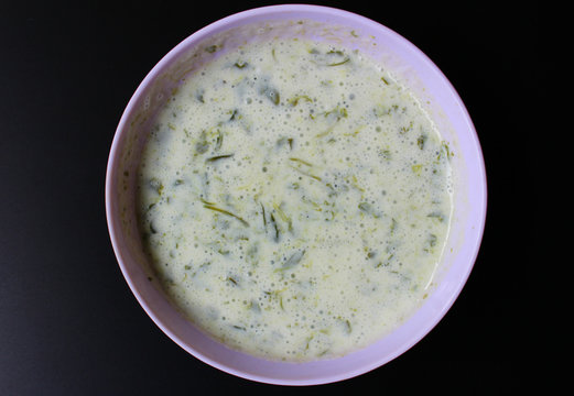 Bathua Raita in plastic bowl