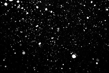falling snow, white spots on a black background, snowfields on a black background