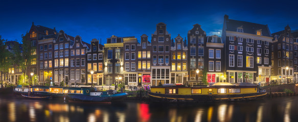 River, traditional old houses and boats, Amsterdam