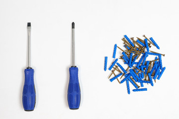 Blue hand screwdrivers and screws isolated on white background.