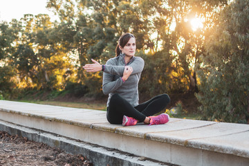 young athlete woman doing stretching in the park