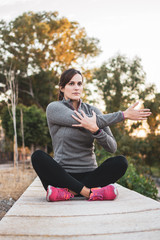 young athlete woman doing stretching in the park