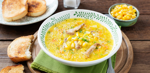 Creamy corn soup with vegetables and meat. 